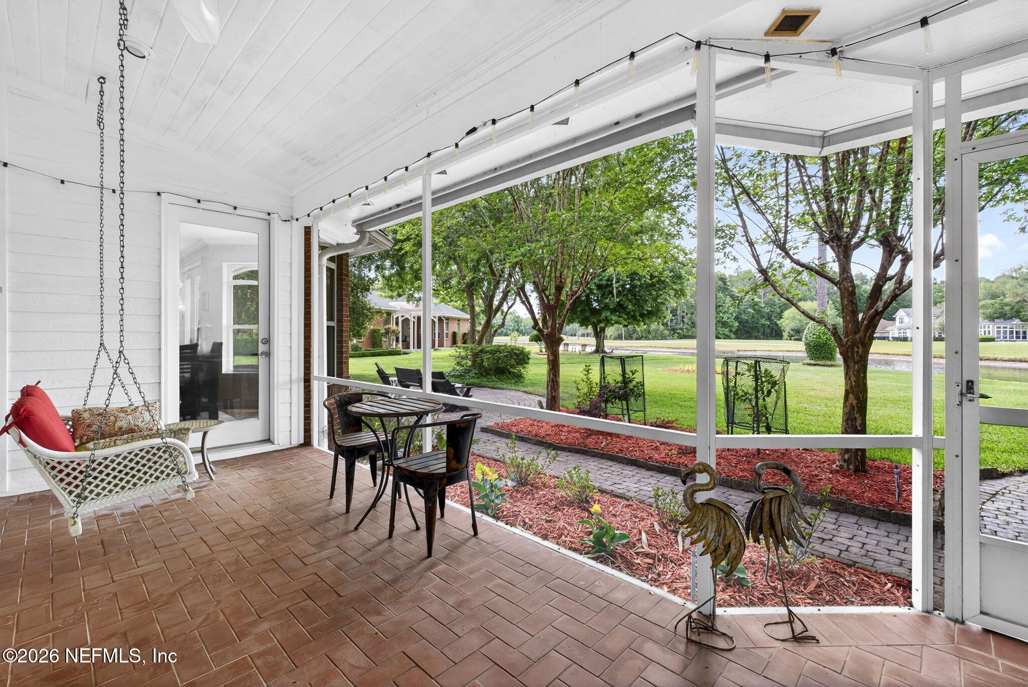 7914 Mc Laurin Road North Jacksonville, FL 32256 - Photo 30 of 44 a view of a patio with a table chairs and backyard