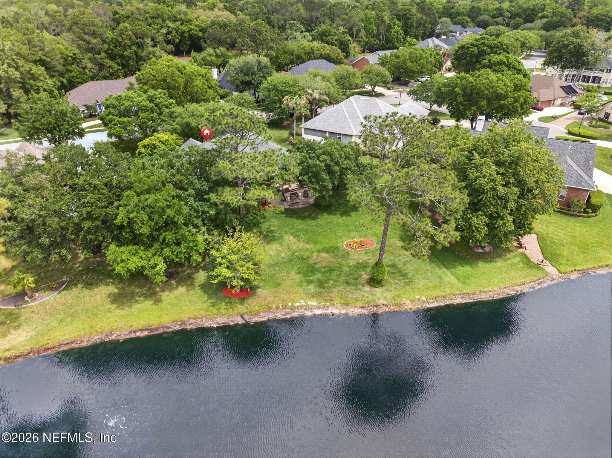 7914 Mc Laurin Road North Jacksonville, FL 32256 - Photo 33 of 44 a view of a wooden house with a yard