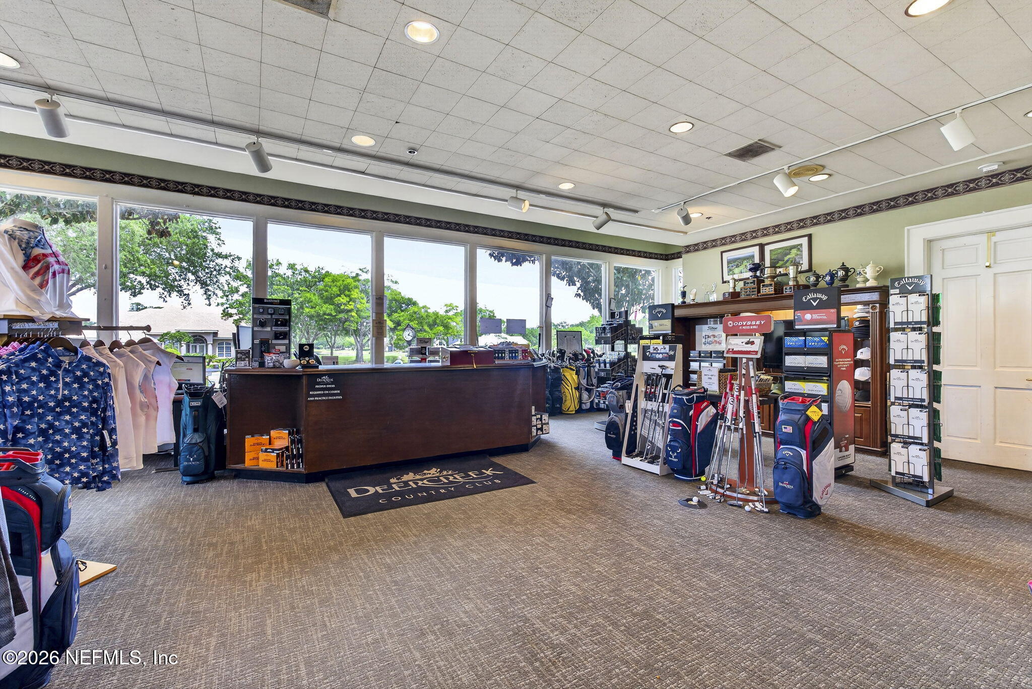 7914 Mc Laurin Road North Jacksonville, FL 32256 - Photo 41 of 44 a room with gym equipment and a chandelier