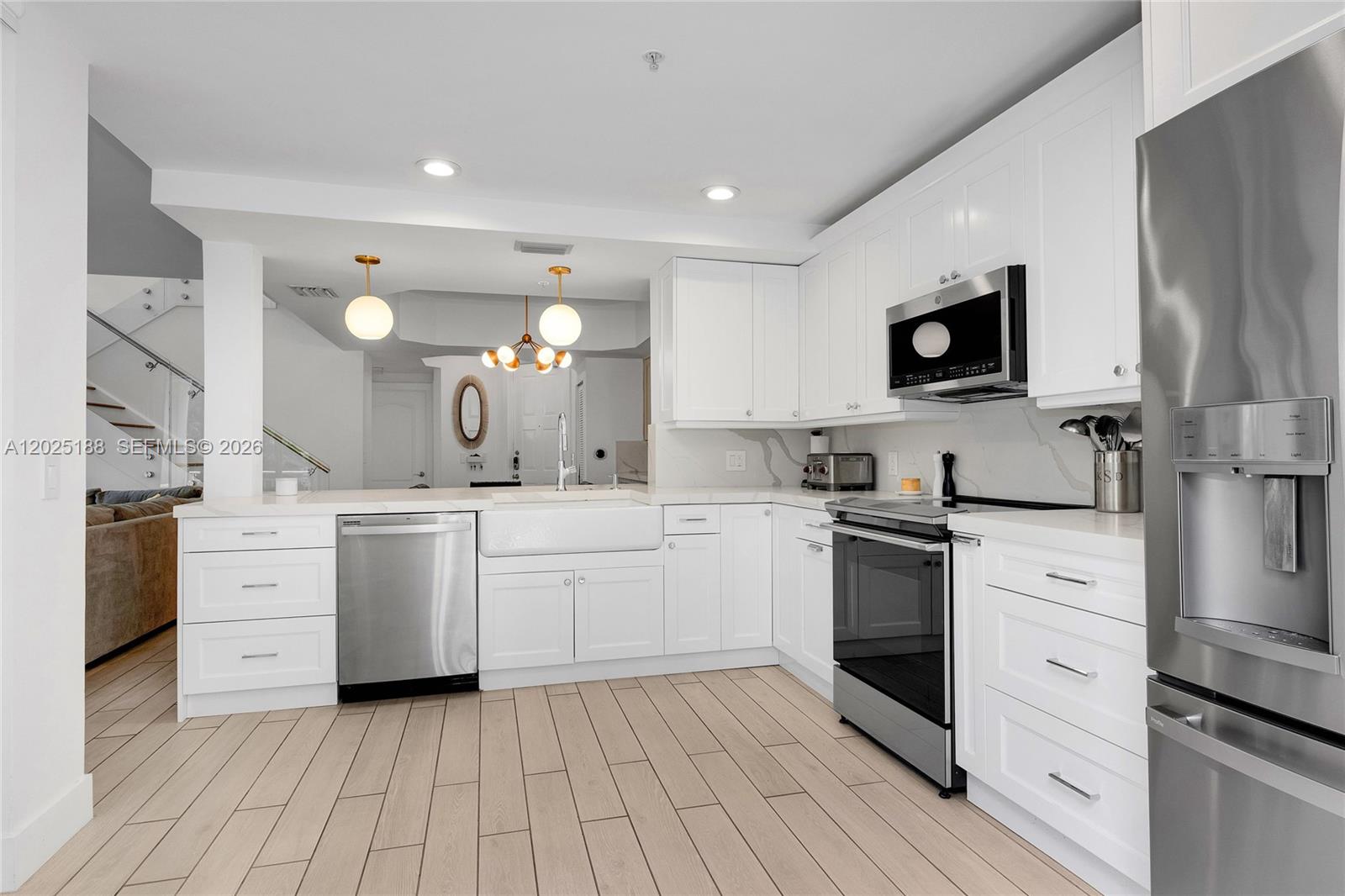 7620 Southwest 102nd Street, Unit 121 Pinecrest, FL 33156 - Photo 5 of 18 a kitchen with cabinets oven and a sink