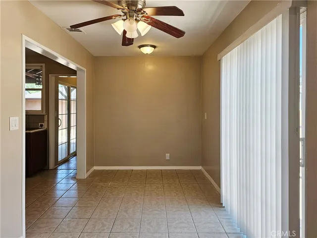 a view of an entryway with a chandelier fan