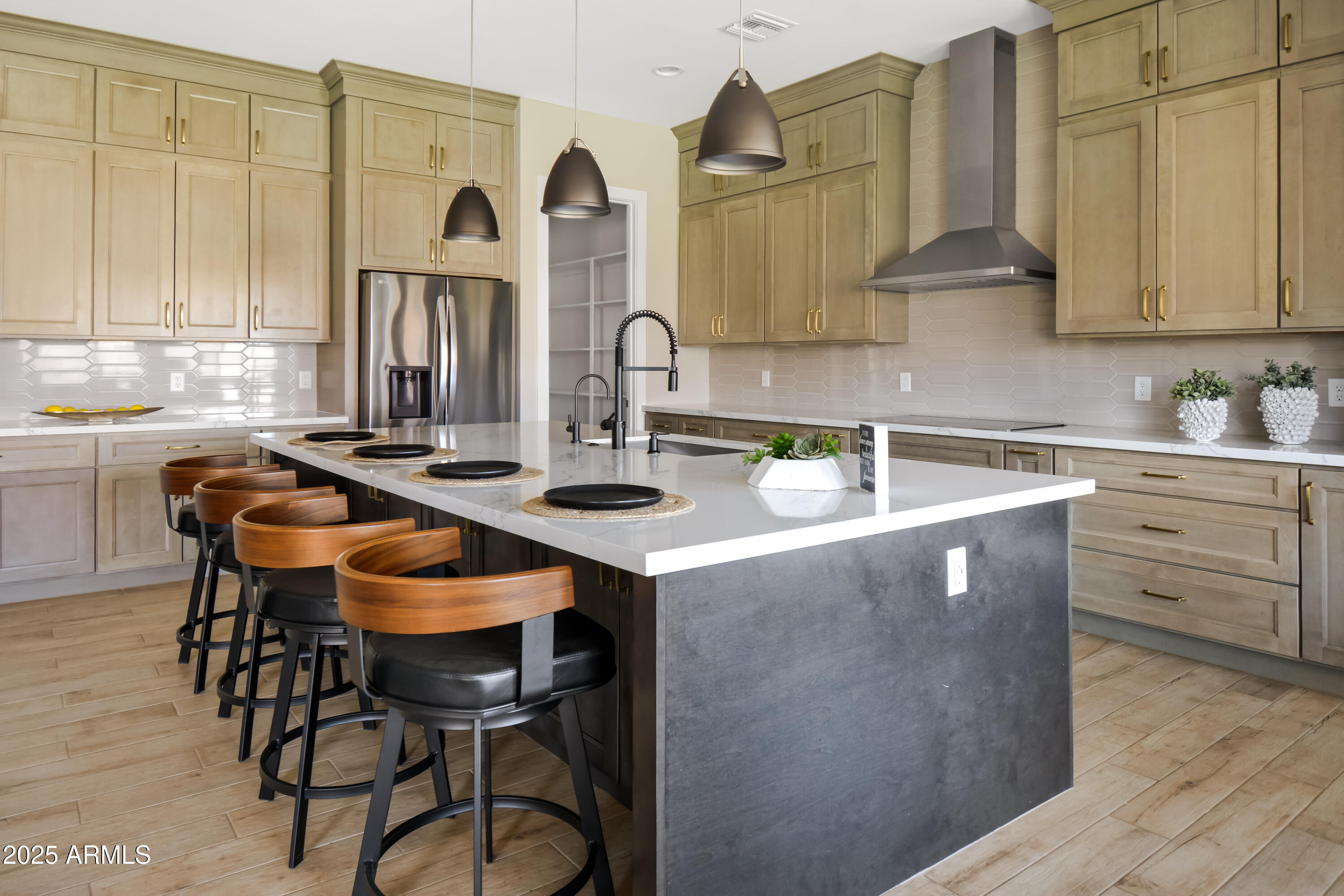 2775 South Baker Apache Junction, AZ 85118 - Photo 14 of 47 a kitchen with stainless steel appliances kitchen island granite countertop a table chairs in it and white cabinets