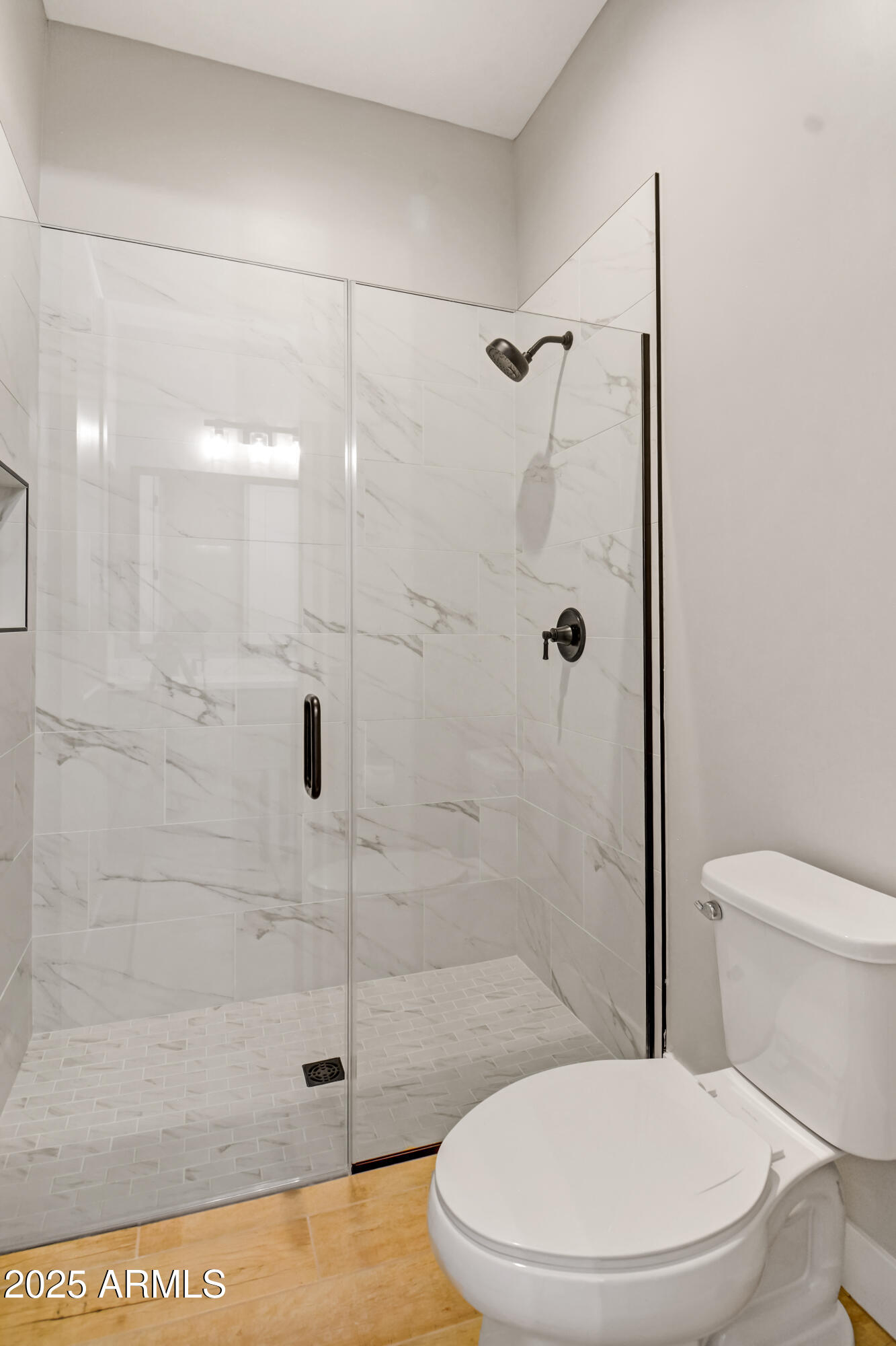 2775 South Baker Apache Junction, AZ 85118 - Photo 26 of 47 a white toilet next to a bathroom