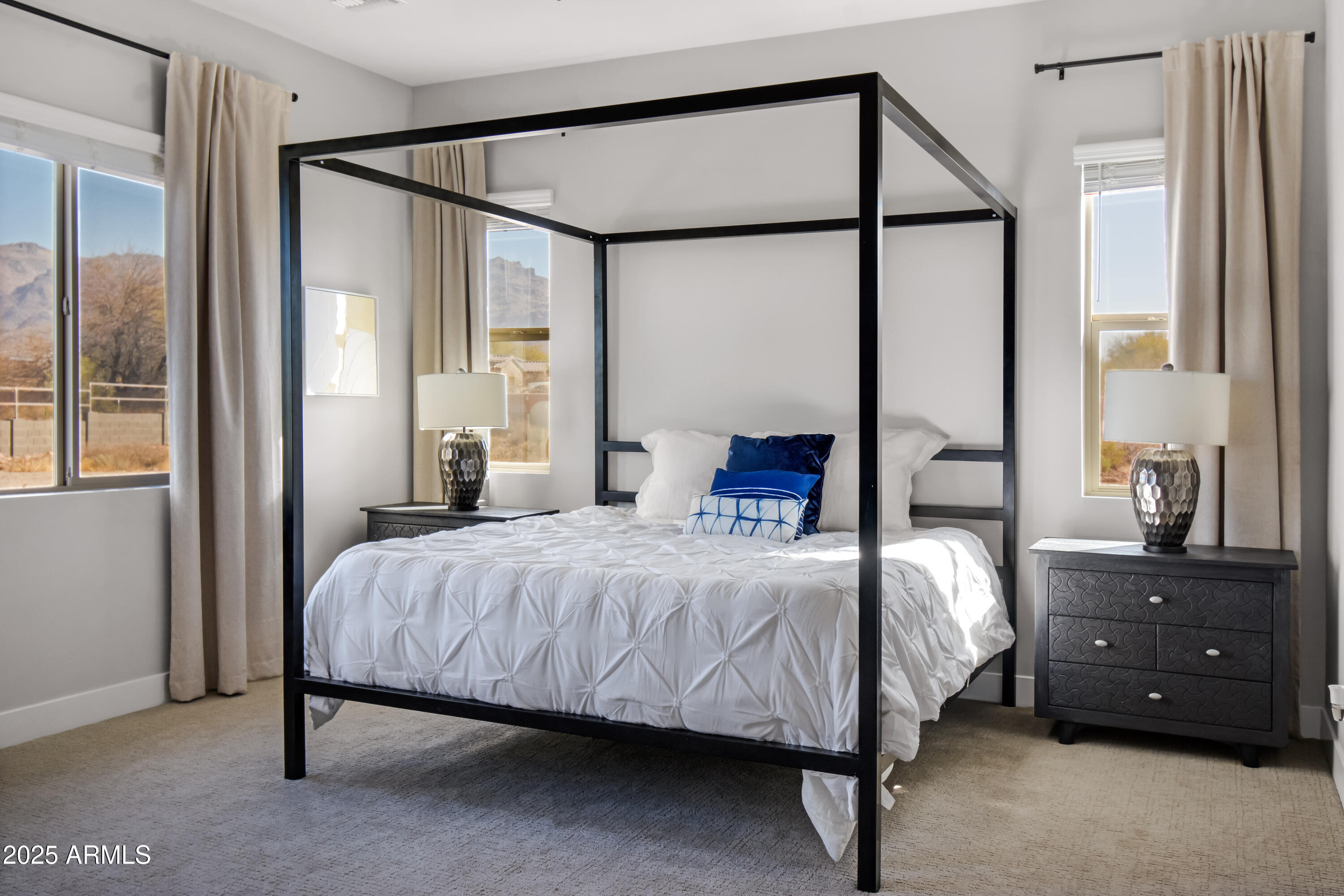 2775 South Baker Apache Junction, AZ 85118 - Photo 31 of 47 a bedroom with a bed and a mirror