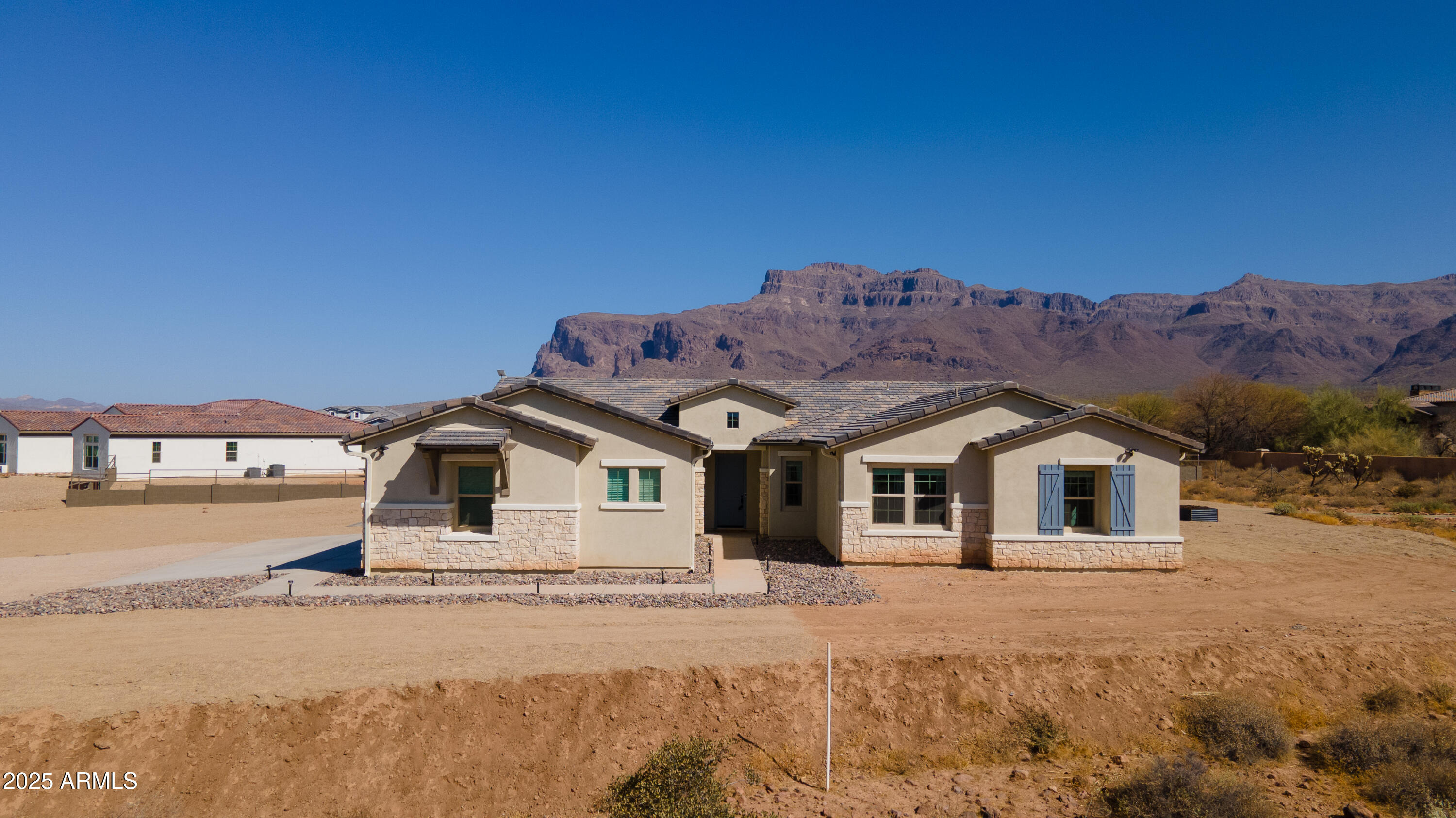 2775 South Baker Apache Junction, AZ 85118 - Photo 4 of 47 a front view of a house with a yard