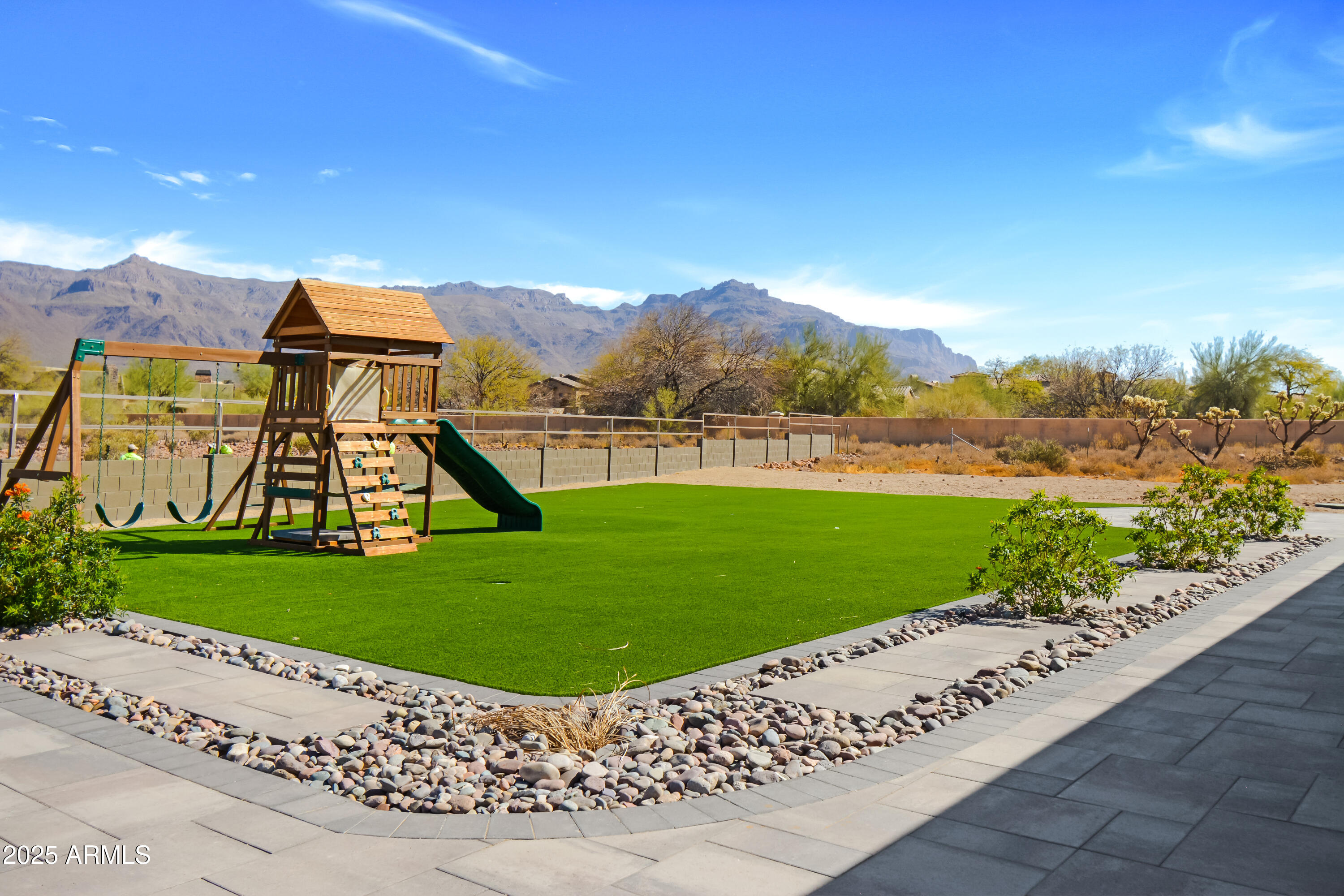 2775 South Baker Apache Junction, AZ 85118 - Photo 44 of 47 a view of a garden with a building in the background