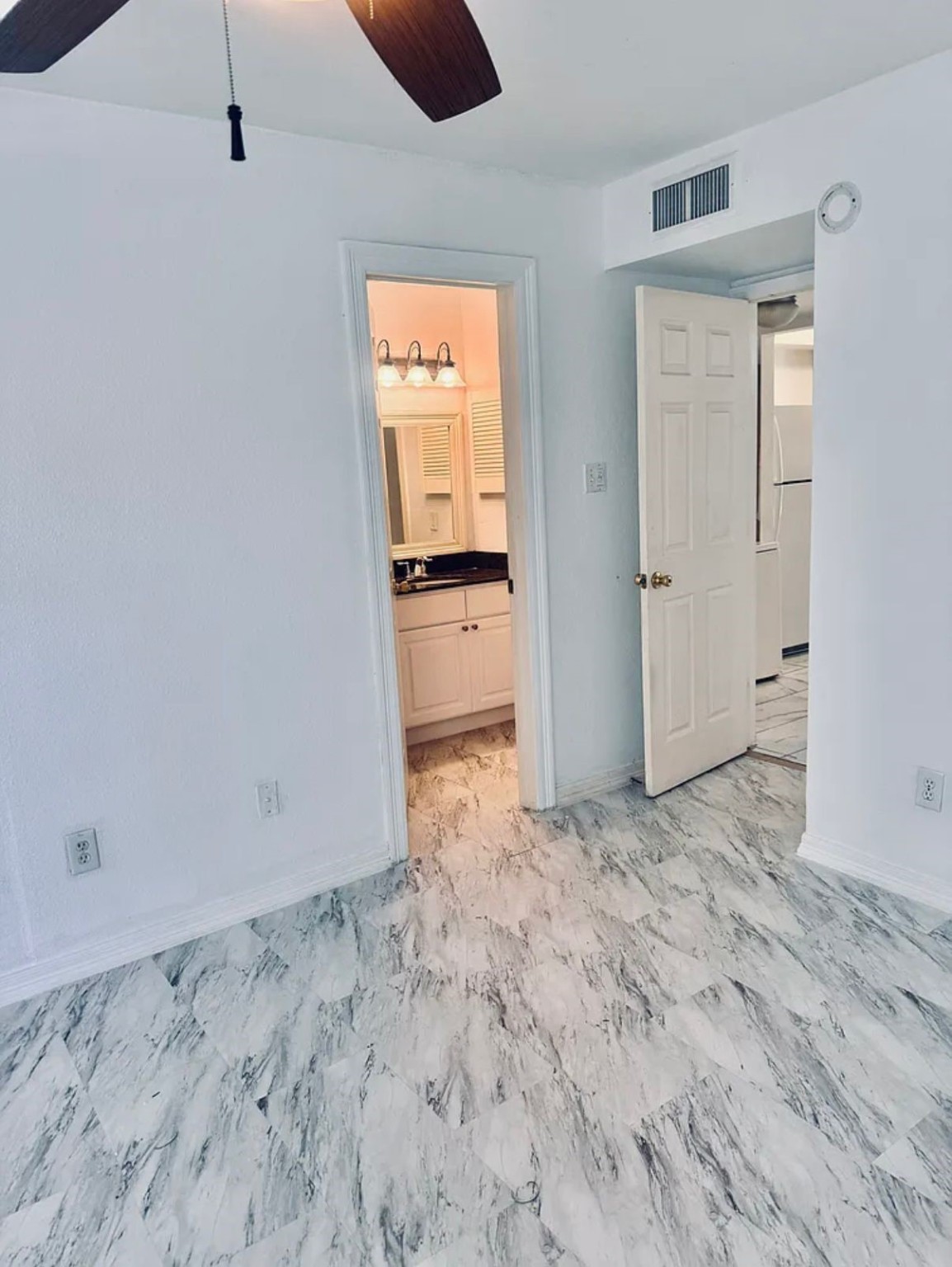 16111 Aspenglenn Drive, Unit 407 Houston, TX 77084 - Photo 11 of 15 a view of a bathroom with a sink and a mirror