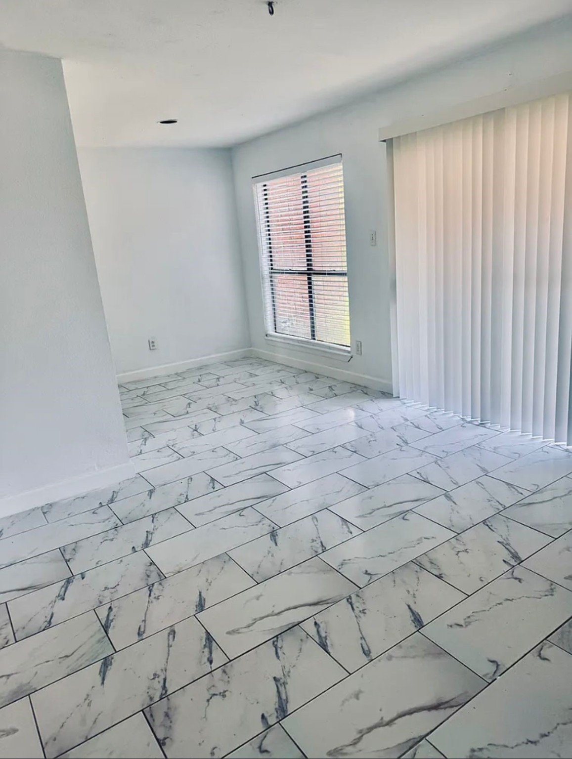 16111 Aspenglenn Drive, Unit 407 Houston, TX 77084 - Photo 10 of 15 a view of empty room with windows