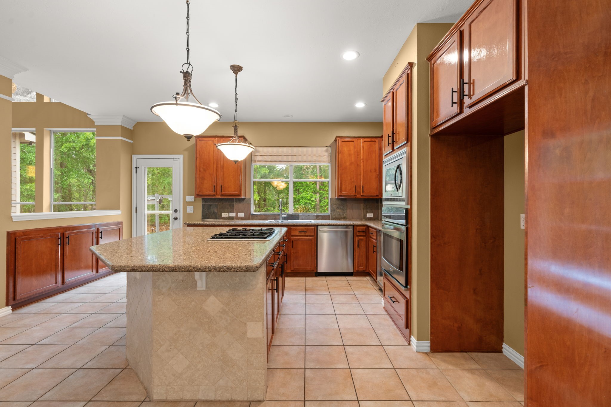 13258 Overlook Court Conroe, TX 77302 - Photo 15 of 49 SS appliances and plenty of storage in the expansive kitchen.