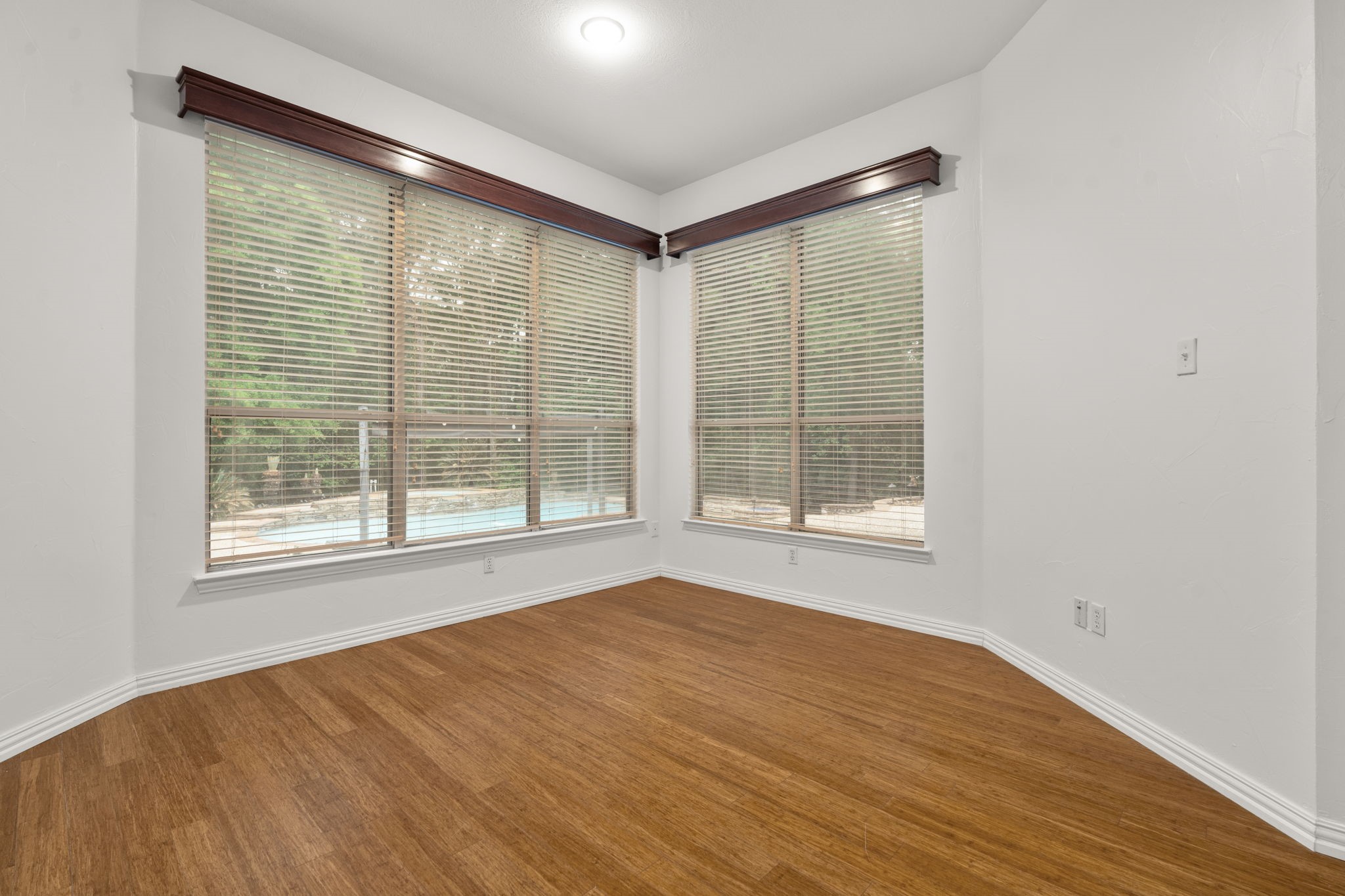 13258 Overlook Court Conroe, TX 77302 - Photo 22 of 49 Primary bedroom with views of the pool and backyard space.