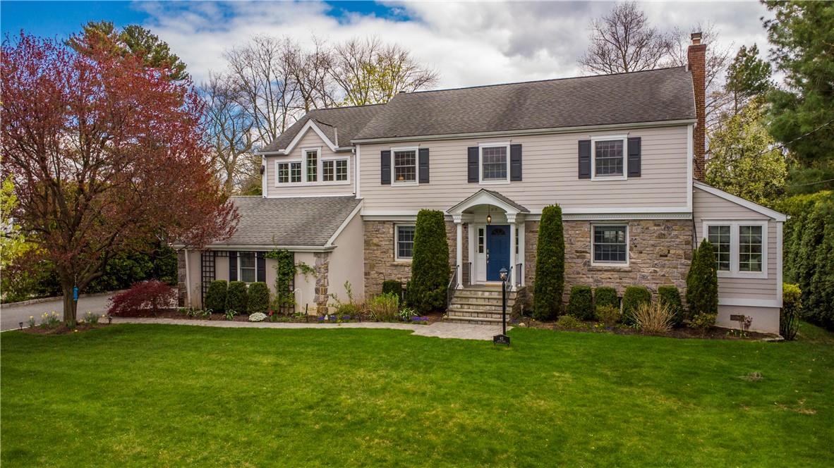 93 S Road Harrison, NY 10528 - Photo 1 of 1 a front view of a house with a yard