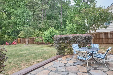 a view of a wooden floor and chairs in the patio