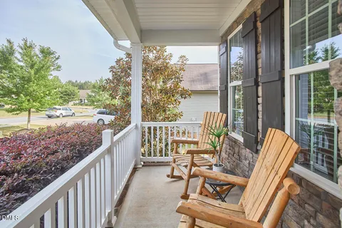 a view of roof deck with furniture