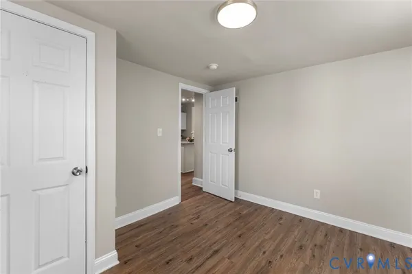 a view of hallway with wooden floor