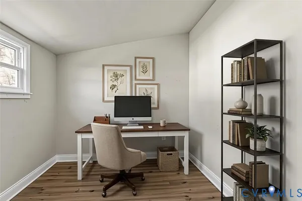 a workspace with furniture and wooden floor