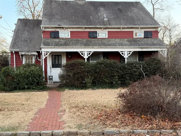 a view of house with yard