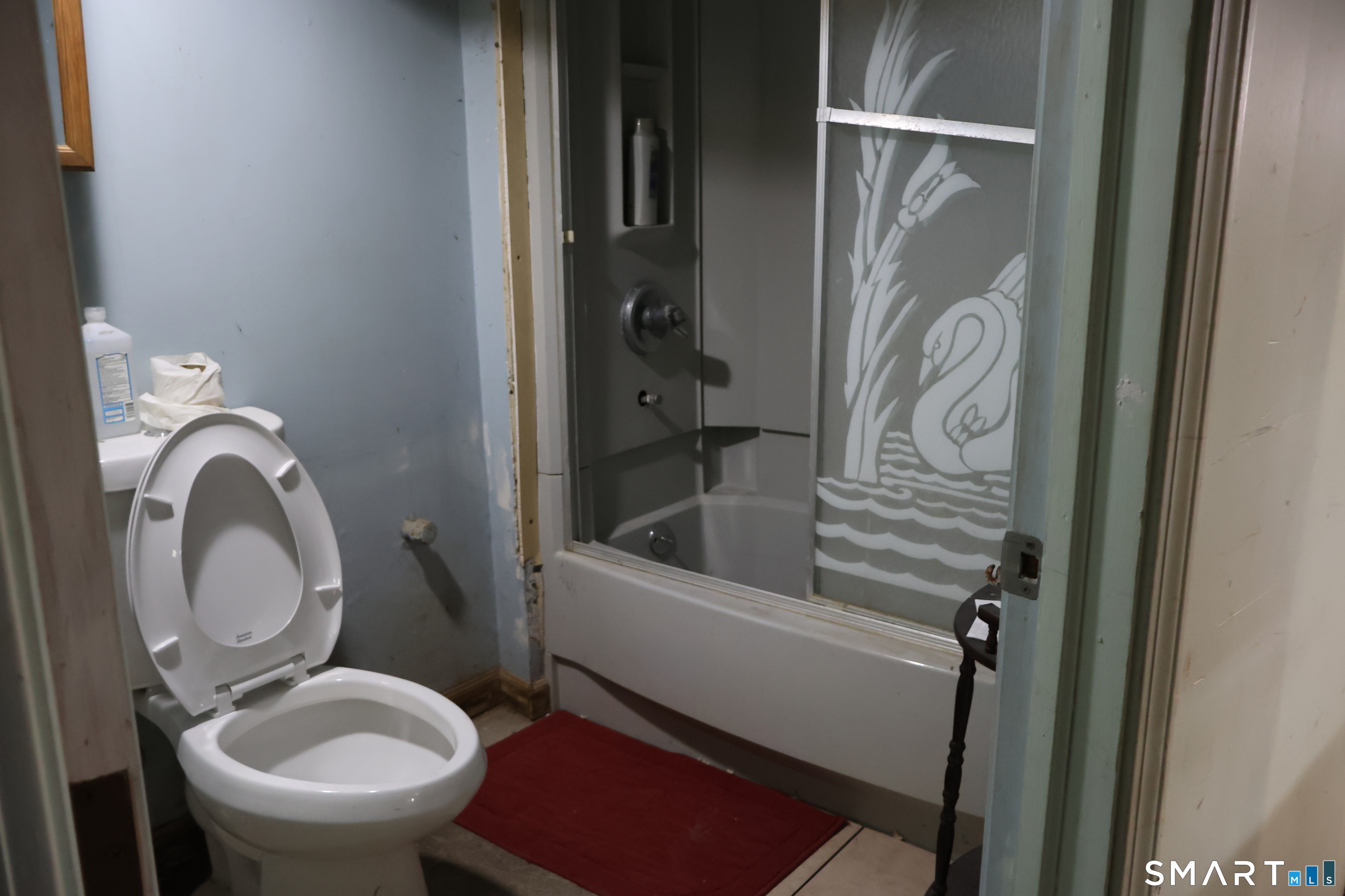 a bathroom with a toilet and a sink