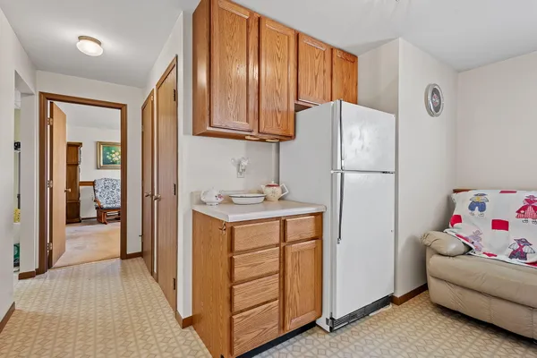 a utility room with cabinets washer and dryer