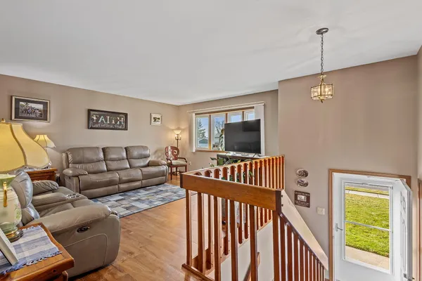 a living room with furniture tv and a window