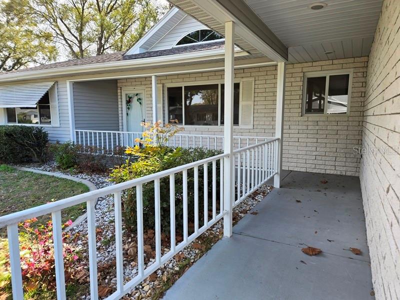 11510 Southwest 85th Court Ocala, FL 34481 - Photo 2 of 39 a view of a house with wooden fence