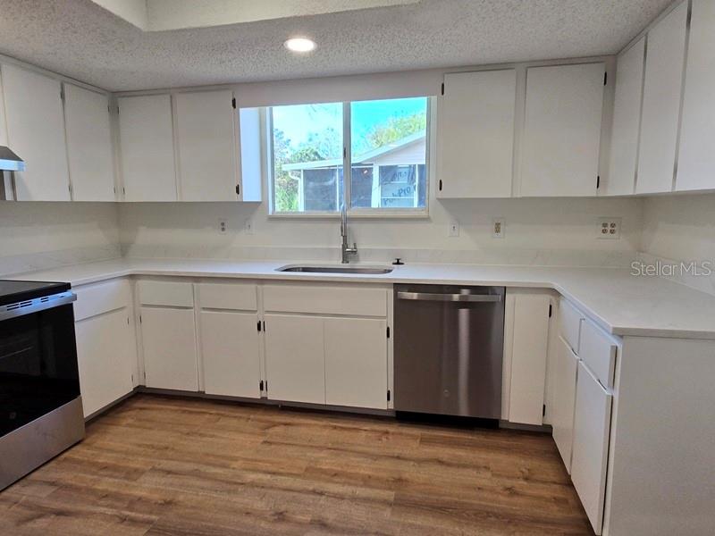 11510 Southwest 85th Court Ocala, FL 34481 - Photo 31 of 39 a kitchen with a sink window and cabinets