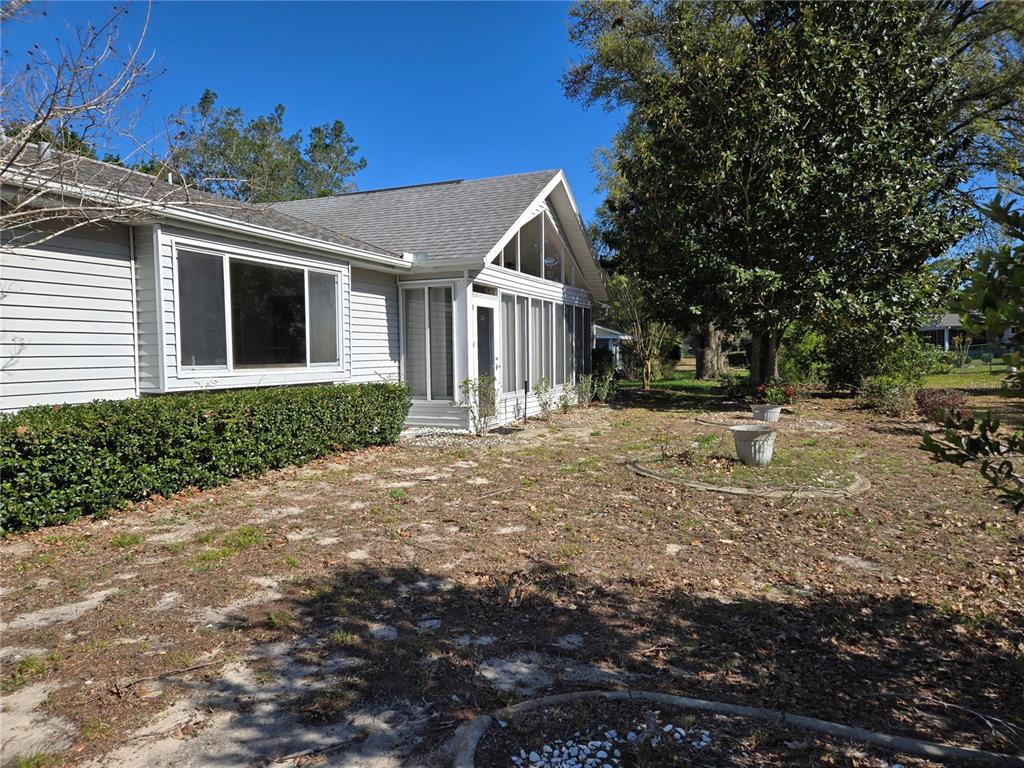 11510 Southwest 85th Court Ocala, FL 34481 - Photo 38 of 39 a front view of a house with a yard