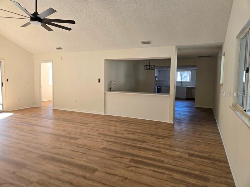 11510 Southwest 85th Court Ocala, FL 34481 - Photo 4 of 39 a view of a hallway with wooden floor