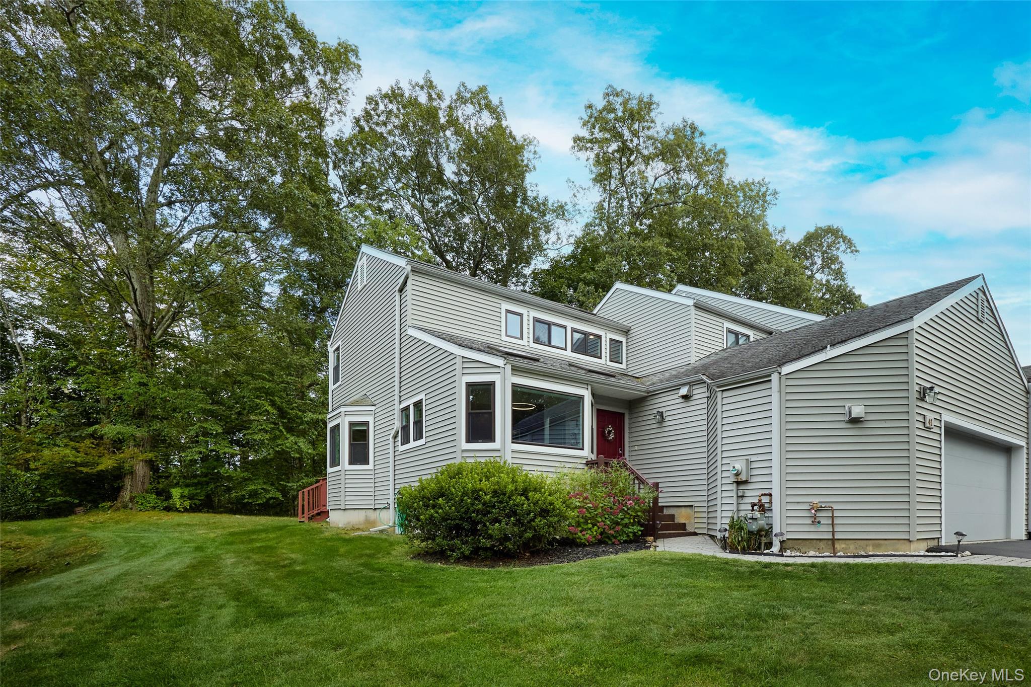 41 Bridle Path Road Ossining, NY 10562 - Photo 1 of 1 View of front facade featuring a front yard and a garage
