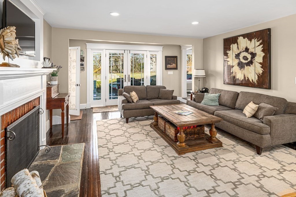 3 Cricket Circle Scituate, MA 02066 - Photo 15 of 42 a living room with furniture and a fireplace