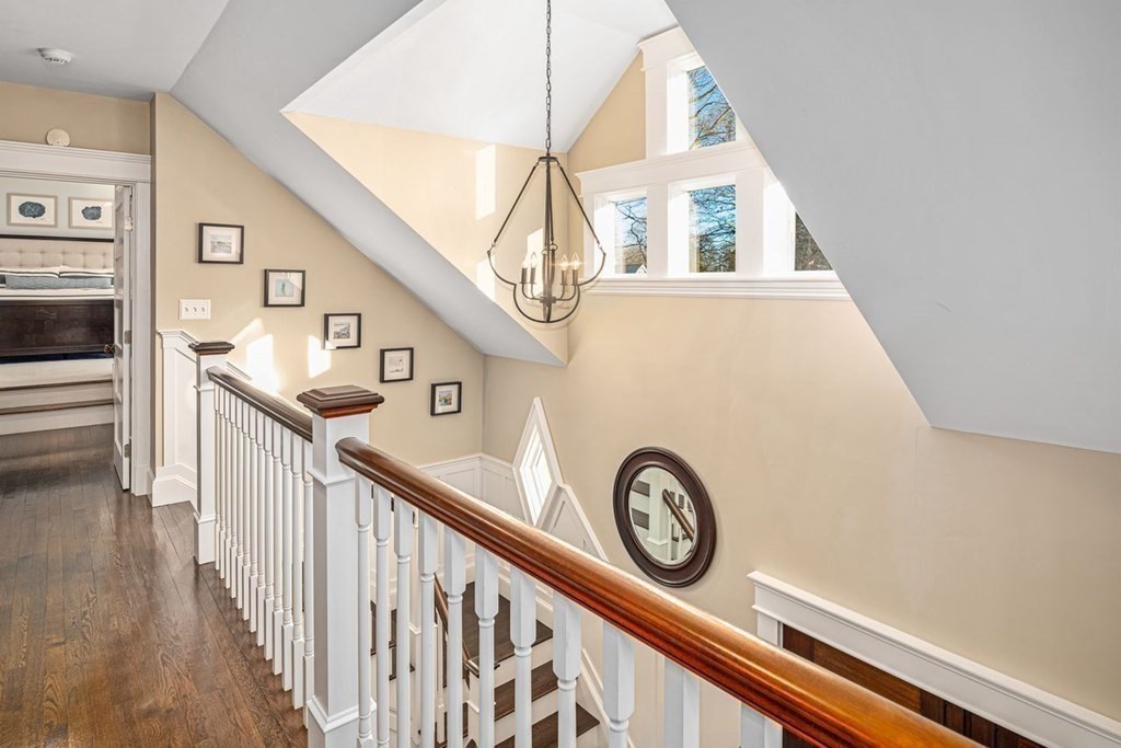 3 Cricket Circle Scituate, MA 02066 - Photo 18 of 42 a view of a hallway with entryway a wooden floor and a sink