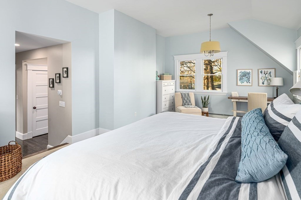 3 Cricket Circle Scituate, MA 02066 - Photo 19 of 42 a bedroom with a bed and wooden floor