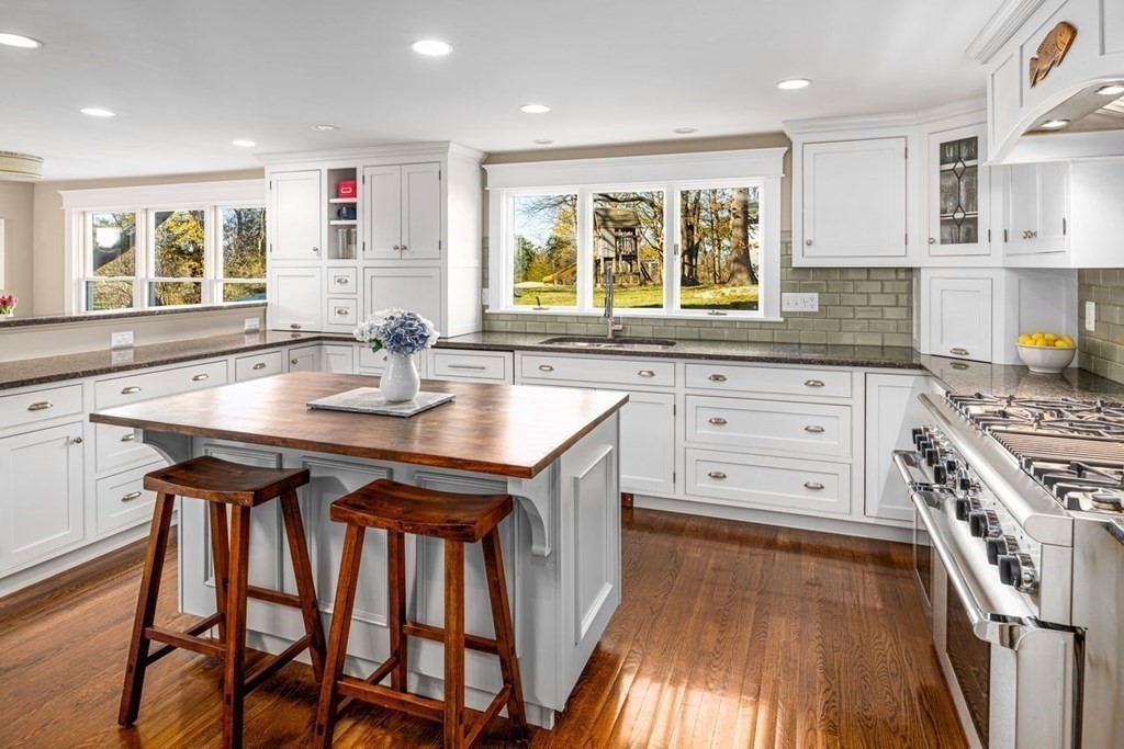 3 Cricket Circle Scituate, MA 02066 - Photo 2 of 42 a kitchen with stainless steel appliances granite countertop a stove a sink dishwasher and cabinets with wooden floor