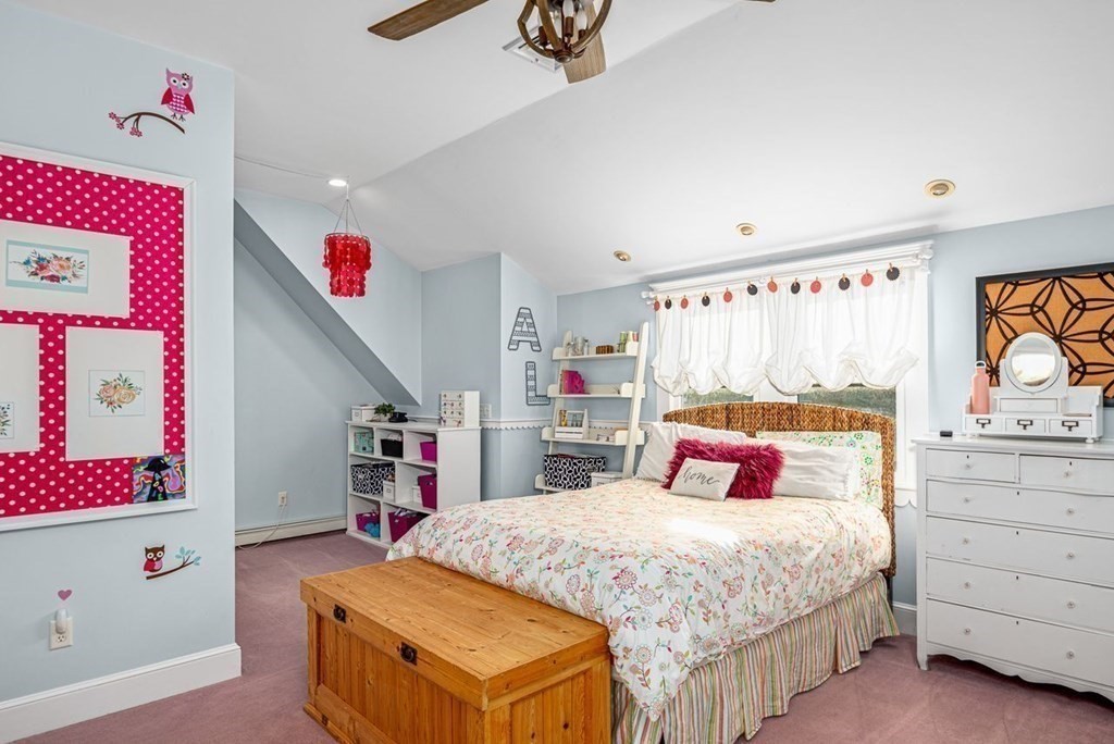 3 Cricket Circle Scituate, MA 02066 - Photo 23 of 42 a bedroom with a bed and cabinets