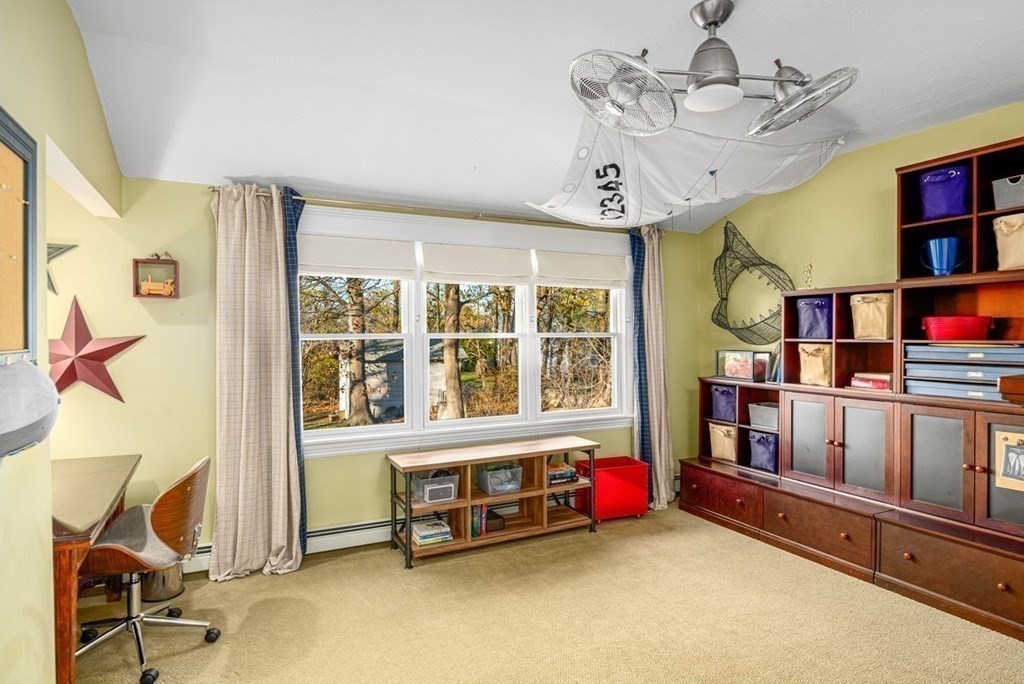 3 Cricket Circle Scituate, MA 02066 - Photo 25 of 42 a living room with furniture cabinets and a window