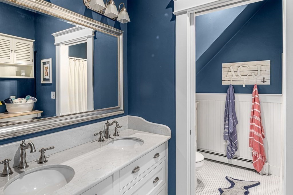 3 Cricket Circle Scituate, MA 02066 - Photo 27 of 42 a bathroom with a granite countertop sink and a mirror