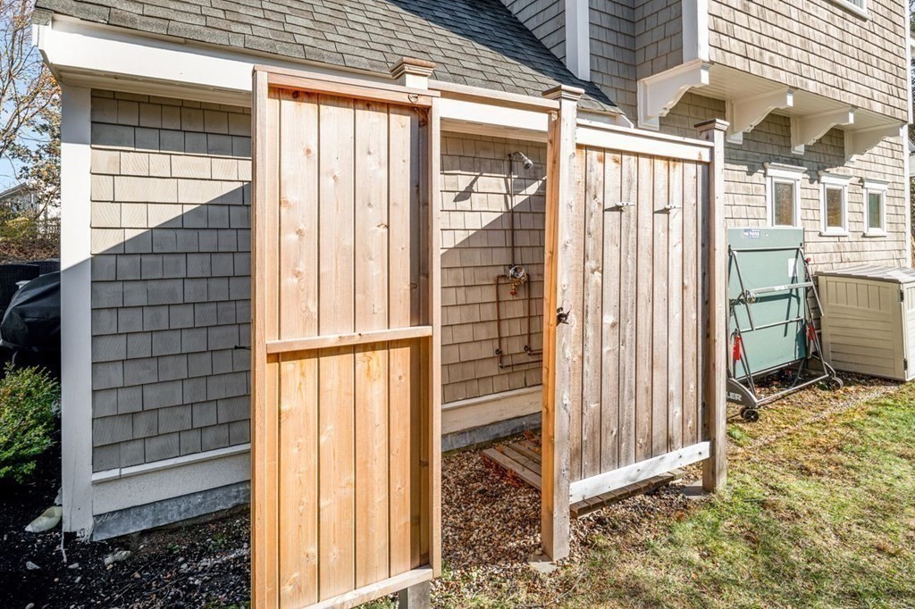 3 Cricket Circle Scituate, MA 02066 - Photo 34 of 42 a view of a porch with a table and chair