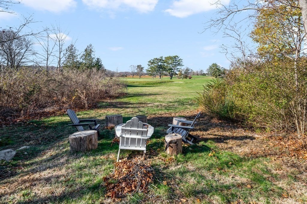 3 Cricket Circle Scituate, MA 02066 - Photo 35 of 42 a view of a garden with lawn chairs and a fire pit
