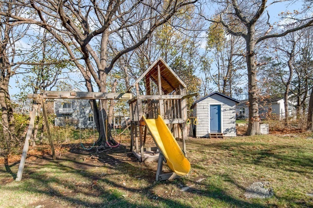 3 Cricket Circle Scituate, MA 02066 - Photo 37 of 42 a view of a house with a yard covered with snow
