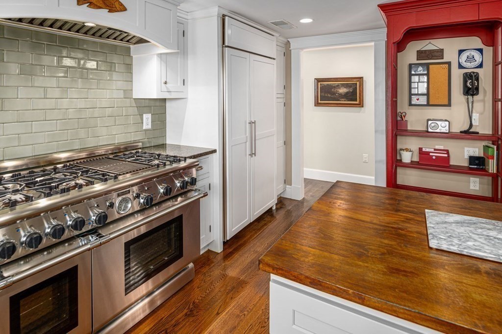 3 Cricket Circle Scituate, MA 02066 - Photo 6 of 42 a kitchen with stainless steel appliances granite countertop a stove and a refrigerator