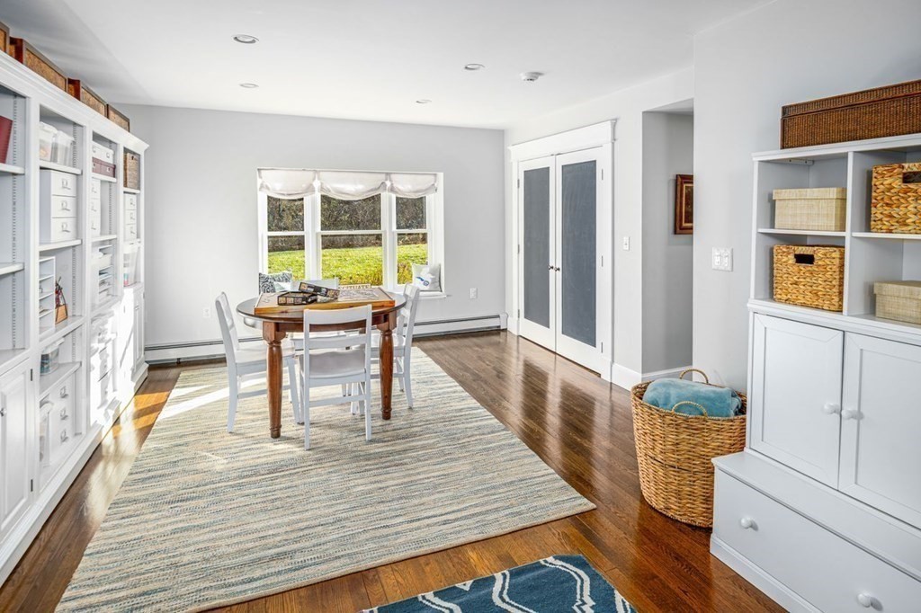 3 Cricket Circle Scituate, MA 02066 - Photo 9 of 42 a dining room with wooden floor and windows