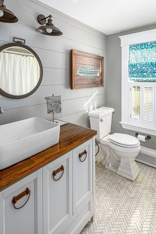 3 Cricket Circle Scituate, MA 02066 - Photo 10 of 42 a bathroom with a sink a toilet and a mirror