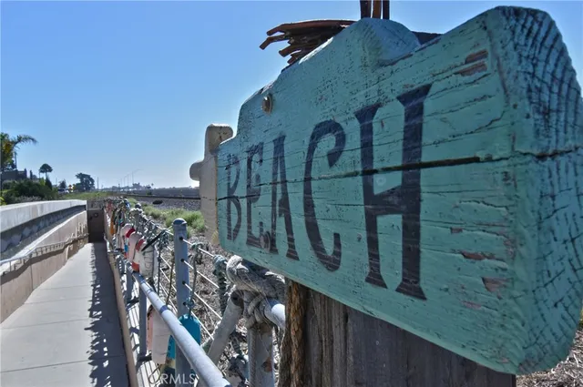 a view of a backyard with wooden fence