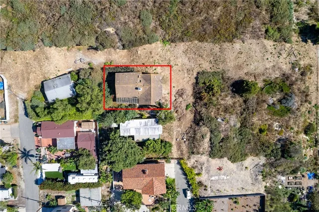 an aerial view of a houses with outdoor space