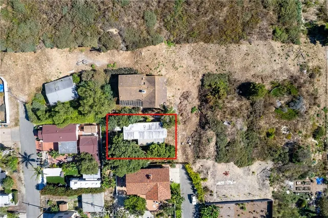 an aerial view of a houses with outdoor space
