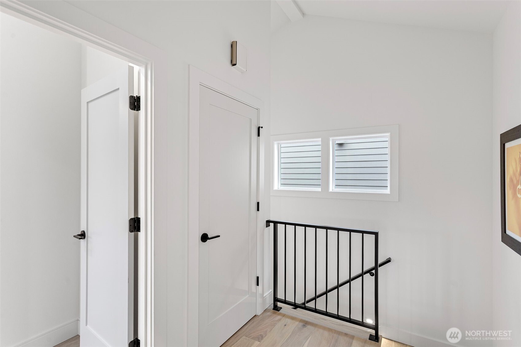 8003 25th Avenue Northwest Seattle, WA 98117 - Photo 17 of 25 a view of a hallway with a window