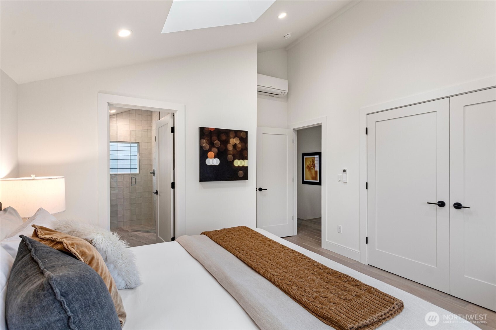 8003 25th Avenue Northwest Seattle, WA 98117 - Photo 20 of 25 a bedroom with a bed and a lamp
