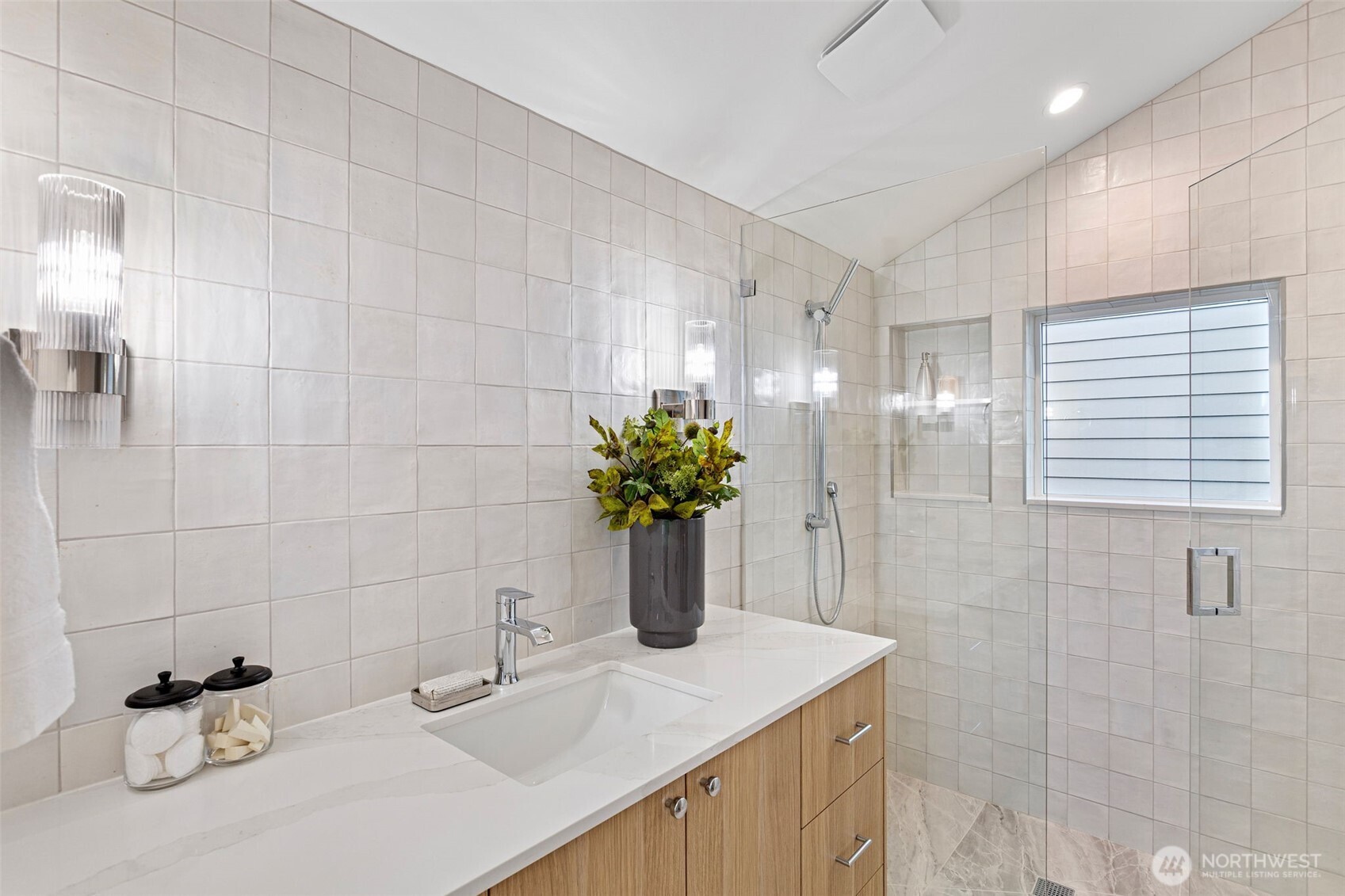 8003 25th Avenue Northwest Seattle, WA 98117 - Photo 21 of 25 a bathroom with a sink a vanity and a mirror