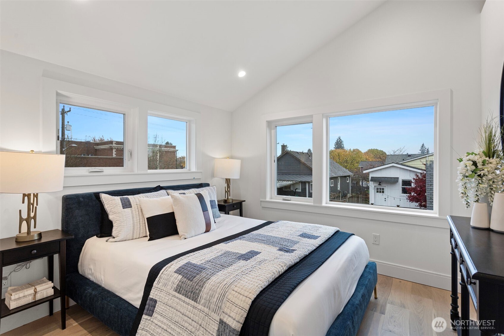 8003 25th Avenue Northwest Seattle, WA 98117 - Photo 22 of 25 a bedroom with a large bed and a large window