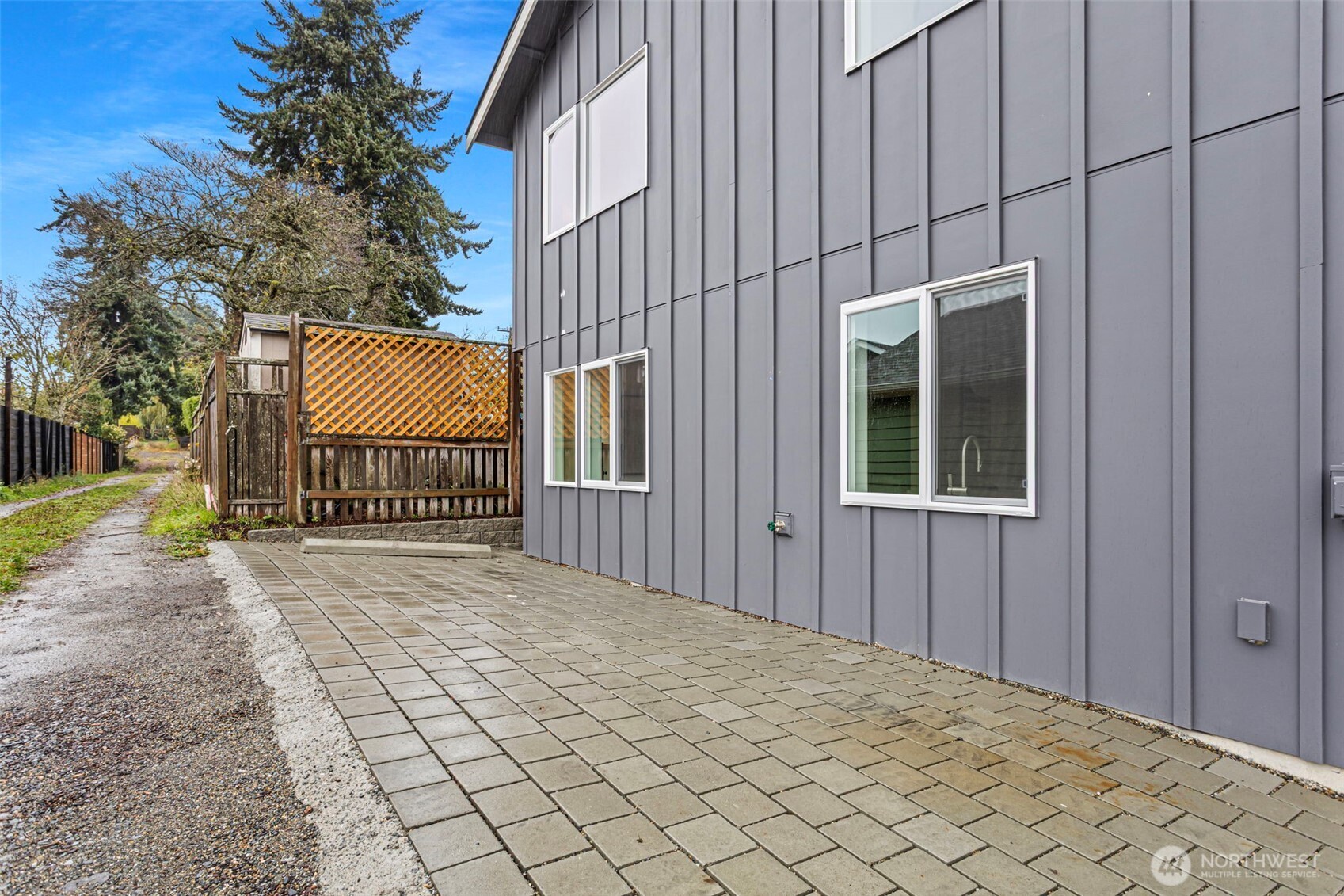 8003 25th Avenue Northwest Seattle, WA 98117 - Photo 25 of 25 a view of a house with backyard and trees