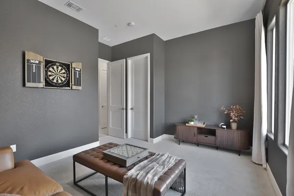 a room with a sink cabinets and utility